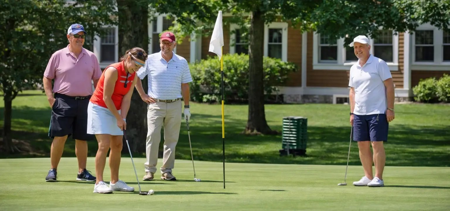 GENERAL - Friends Putting on Golf Green